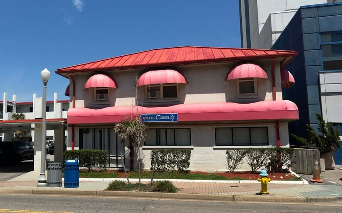 Ocean 27 Ocean Front exterior with signature pink awnings and red roof on Atlantic Avenue