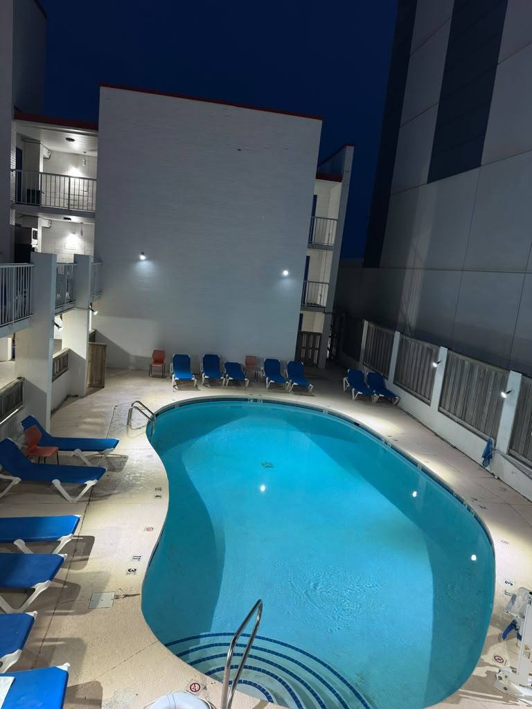 Ocean 27 outdoor pool lit at night